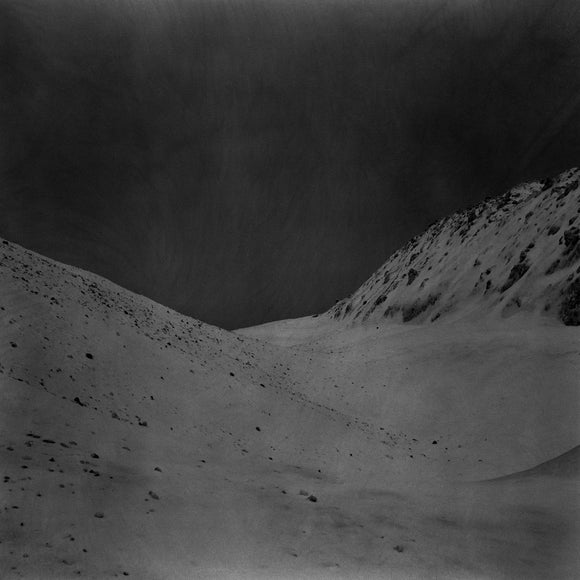 Au De La by BIG|BRAVE on Southern Lord Records (the album artwork is a negative black and white photograph of a landscape with seemingly no life; there is no text or other information on the front of the album)