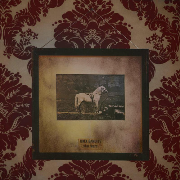 Star Wars by BMX Bandits on Last Night From Glasgow (the album sleeve is an image of a framed black and white photograph of a white horse hanging on a wall-papered wall; the band name and album title are also in the frame, beneath the horse photo).