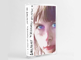 Cassette version of Aquainted With Night by Lael Neale on Sub Pop Records (the album sleeve shows a close up grainy photograph of a sunlit Lael Neale looking at the camera with blue eyes; the artist name and album title is hand-written along the left edge)